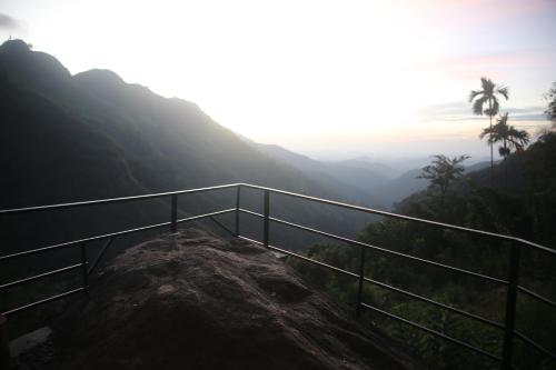 a view from the top of a mountain at Jungle Cave in Ella