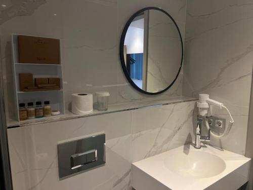 a bathroom with a sink and a mirror at Joyway Hotels Istanbul Sultanahmet in Istanbul