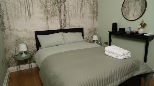 Ένα ή περισσότερα κρεβάτια σε δωμάτιο στο Mandeville Guest House