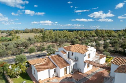 an aerial view of a house with a road and trees at Residence Solaria in Budoni