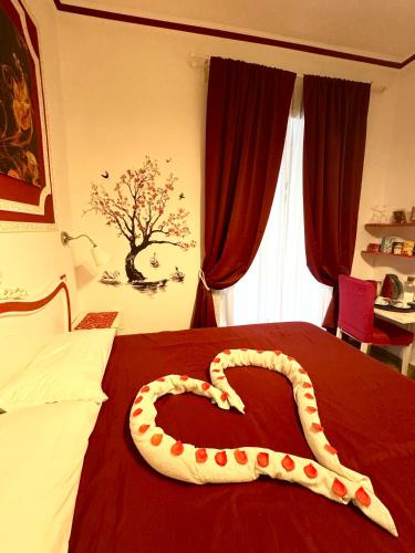 Cama o camas de una habitación en Etere in Prati Rooms