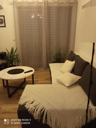 a living room with a couch and a table at Kuća za odmor Donja Grabovica in Valjevo