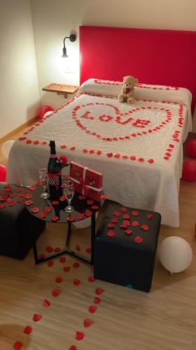 a bedroom with a cake shaped like a bed at Hostal Santa Baia in Ribadumia
