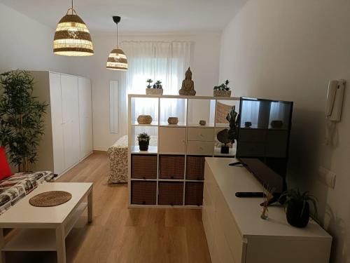 a living room with a couch and a table at Estudio Don Angel in Camas