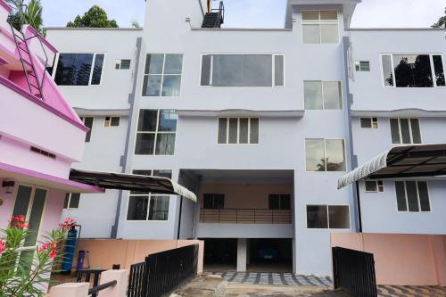 an external view of a building at Super Collection O Companion Leisure Homes in Kovalam