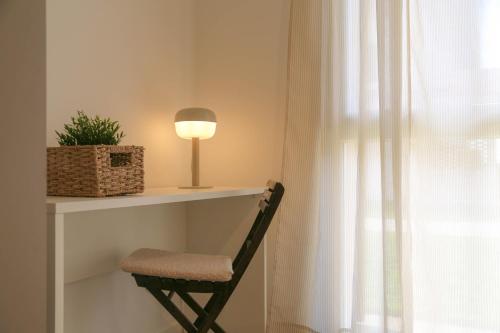 a chair sitting on a shelf next to a window at Barchessa Cappelletto in Torre di Mosto