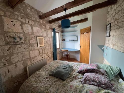 Voodi või voodid majutusasutuse Gîte de charme champêtre toas