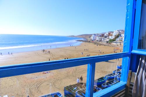 a view of a beach from a window at golden sand appartment 3 in Agadir