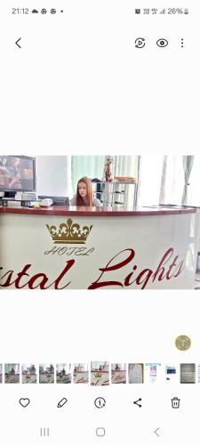 a woman is sitting at a reception desk at HOTEL Crystal Lights in Pirot