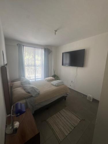 Ένα ή περισσότερα κρεβάτια σε δωμάτιο στο Beautiful apartment near Polanco