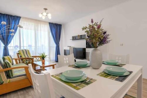 a kitchen and living room with a table and chairs at Infinity view 2 Shkorpilovci in Shkorpilovtsi