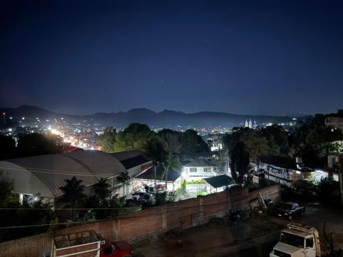a view of a city at night at Casa del Lago in Nuevo San Juan Parangaricutiro