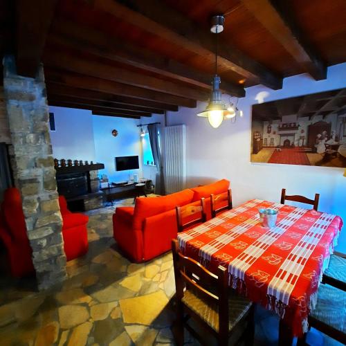a living room with a table and a couch at Chalet Casargo in Casargo