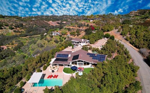 an aerial view of a large house with a pool at Hilltop Villa, Pool, Hot tub, Views, Avocado Grove in Fallbrook