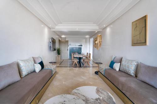 a living room with a couch and a table at Aya Suites in Marrakech