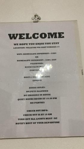 a piece of paper with a welcome sign on it at Open Sweet House in Velletri