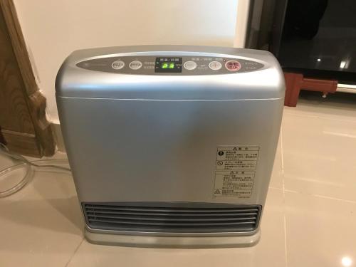 a toaster oven sitting on top of a counter at Stylish Luxe 2 BedroomLK Condo Close to GIGA Mall in Islamabad