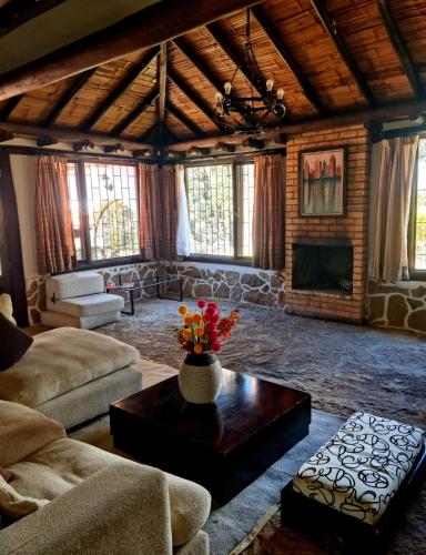 a living room with a couch and a table at La Casona Cucaita. Sede Campestre in Cucaita