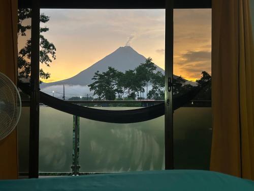 a view of a mountain from a room with a window at Villa JADE, La Fortuna Downtown Apartment in Fortuna