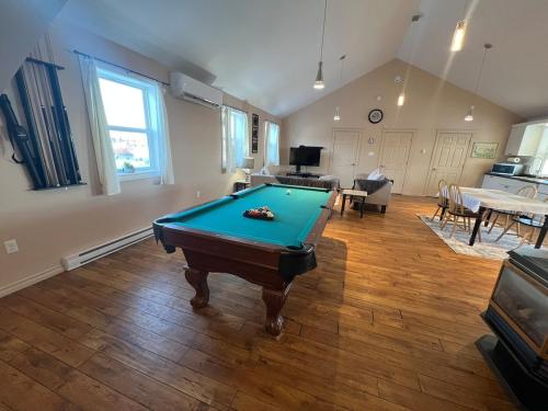 a living room with a pool table in it at Pool Table, Foosball & Darts! in Fredericton