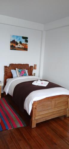 a bedroom with a large bed in a room at Puerto Yumani in Comunidad Yumani