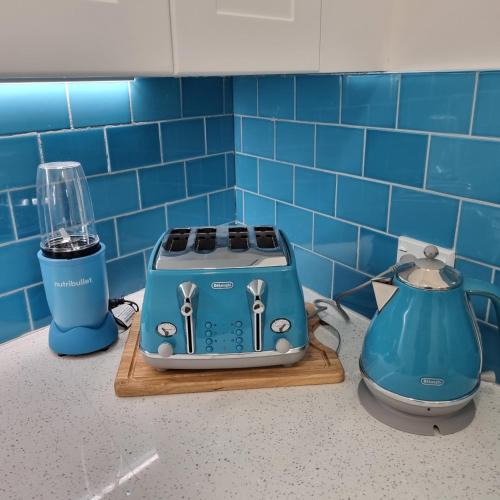 a kitchen counter with a toaster and a blender at Riverstone Retreat Upper Hutt in Upper Hutt