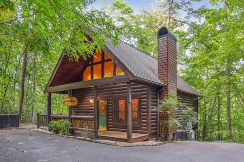 a small log cabin in the woods with trees at Little Pine Lodge a Smokies Hideaway - 1 mi to GSMNP - King Suite & Loft, Fireplace, Hot Tub & BEARS! in Sevierville