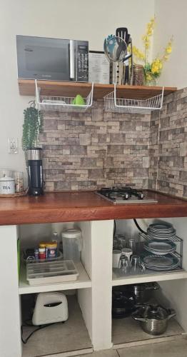 a kitchen with a counter top with a stove at Moon Moods Curaçao in Grote Berg