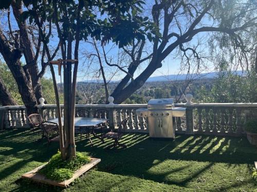 a balcony with a swing and a table and chairs at Specious 6000 sf privat gated villa with View in Fremont