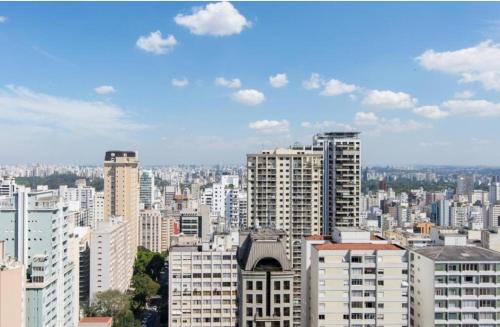 a view of a city with tall buildings at Flat in Wyndham Paulista com estacionamento in Sao Paulo
