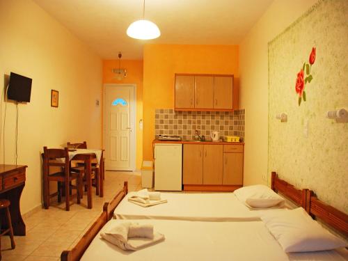 Ένα ή περισσότερα κρεβάτια σε δωμάτιο στο Emilia Apartments