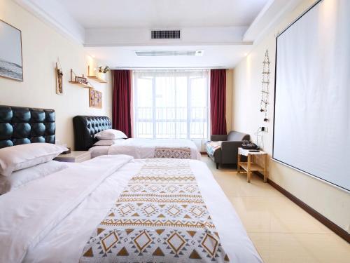 Voodi või voodid majutusasutuse Guangzhou Uhome Service Apartment toas