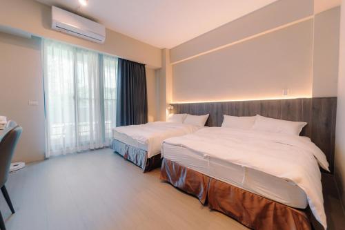 Ein Bett oder Betten in einem Zimmer der Unterkunft Sunny Sky Homestay
