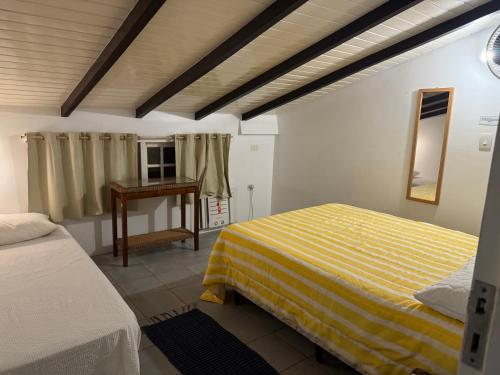 Katil atau katil-katil dalam bilik di Casa 4 quartos Riviera de Sao lourenço Piscina Aquecida