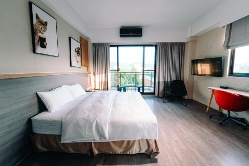 Ein Bett oder Betten in einem Zimmer der Unterkunft Sunny Sky Homestay