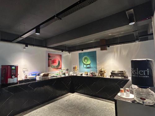 a large kitchen with a counter in a restaurant at Wild Wings Premium Hotel in Hyderabad