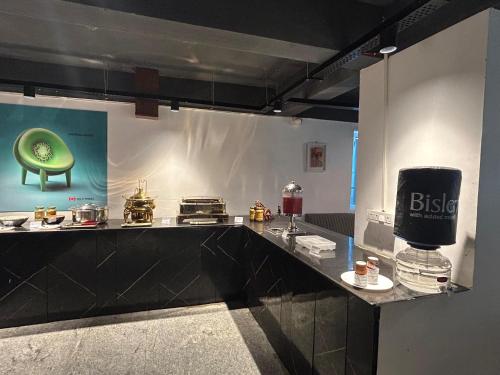 a kitchen with a counter with some food on it at Wild Wings Premium Hotel in Hyderabad