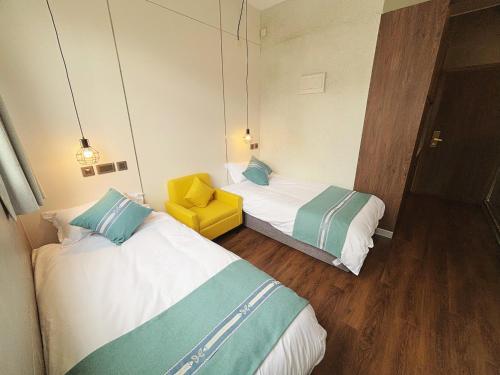 Cama o camas de una habitación en 王子公館King's mansion