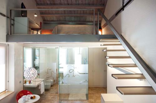 a room with a staircase with a glass door at Hotel AF Pesquera in Peñafiel