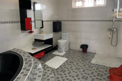 a bathroom with a toilet and a sink and a shower at Le Botanic Oasis 3 beds summer vacation private villa with private pool and garden albion in Albion