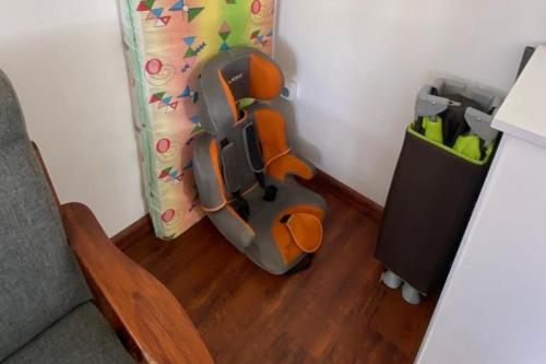 a childs toy car in a corner of a room at Le Botanic Oasis 3 beds summer vacation private villa with private pool and garden albion in Albion