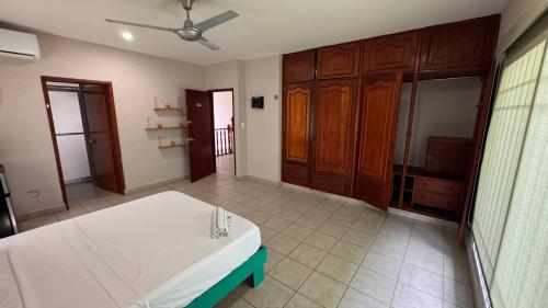 a large room with a bed and a bathroom at Burgos Studio in Cancún