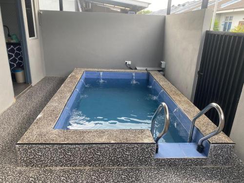a jacuzziificialificialificialificialificialificialificialificialificialificialificial at Ainun Homestay with private pool in Kuantan