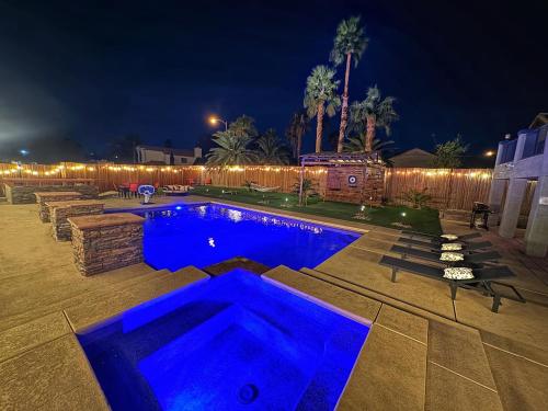 a swimming pool at night with blue lights at Blue Waterfalls in Las Vegas