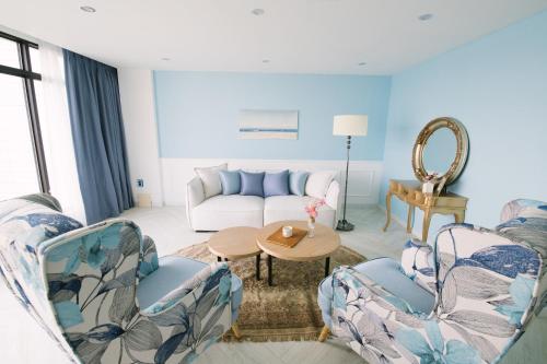 a living room with a couch and a table at Gray hotel in Tongyeong