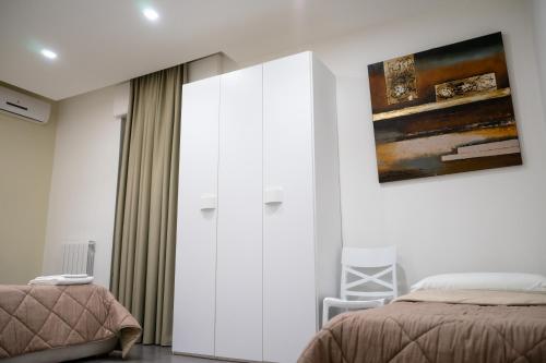 a bedroom with a bed and a large glass door at Alta Dimora in Bitritto