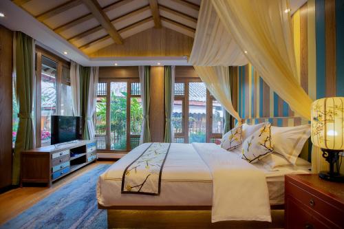 Postelja oz. postelje v sobi nastanitve Lijiang Hearing Flower Hall Garden Inn Butterfly Language Shop