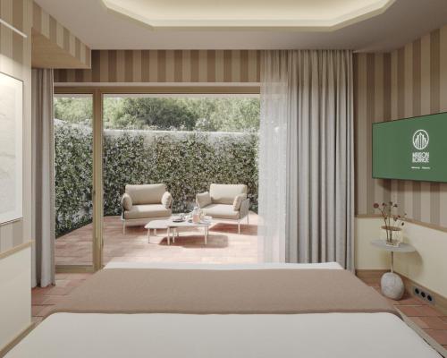 a bedroom with a large bed and a patio at Hôtel Maison Borrèze in Souillac