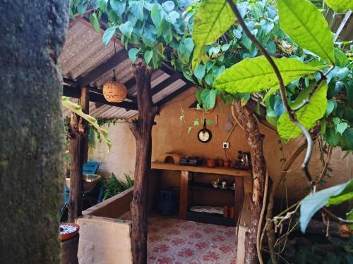 a small room with a table and trees in it at Cool House Cabana in Kamburugamuwa