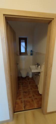 a bathroom with a sink and a tub and a toilet at Residence Lhotka - Žďárské vrchy in Lhotka